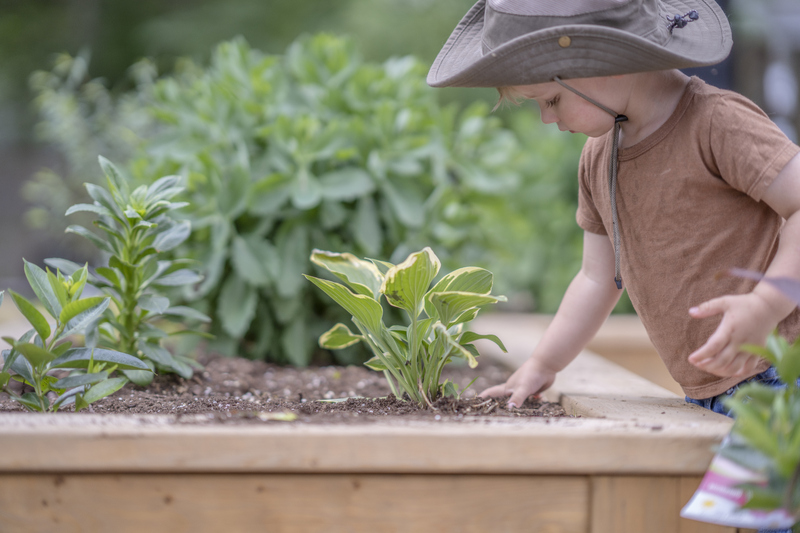 Boy in hat gardening